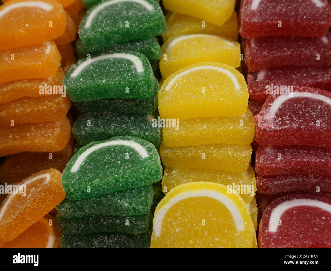 Pile of delicious jelly shaped citrus candies texture background Stock Photo Alamy
