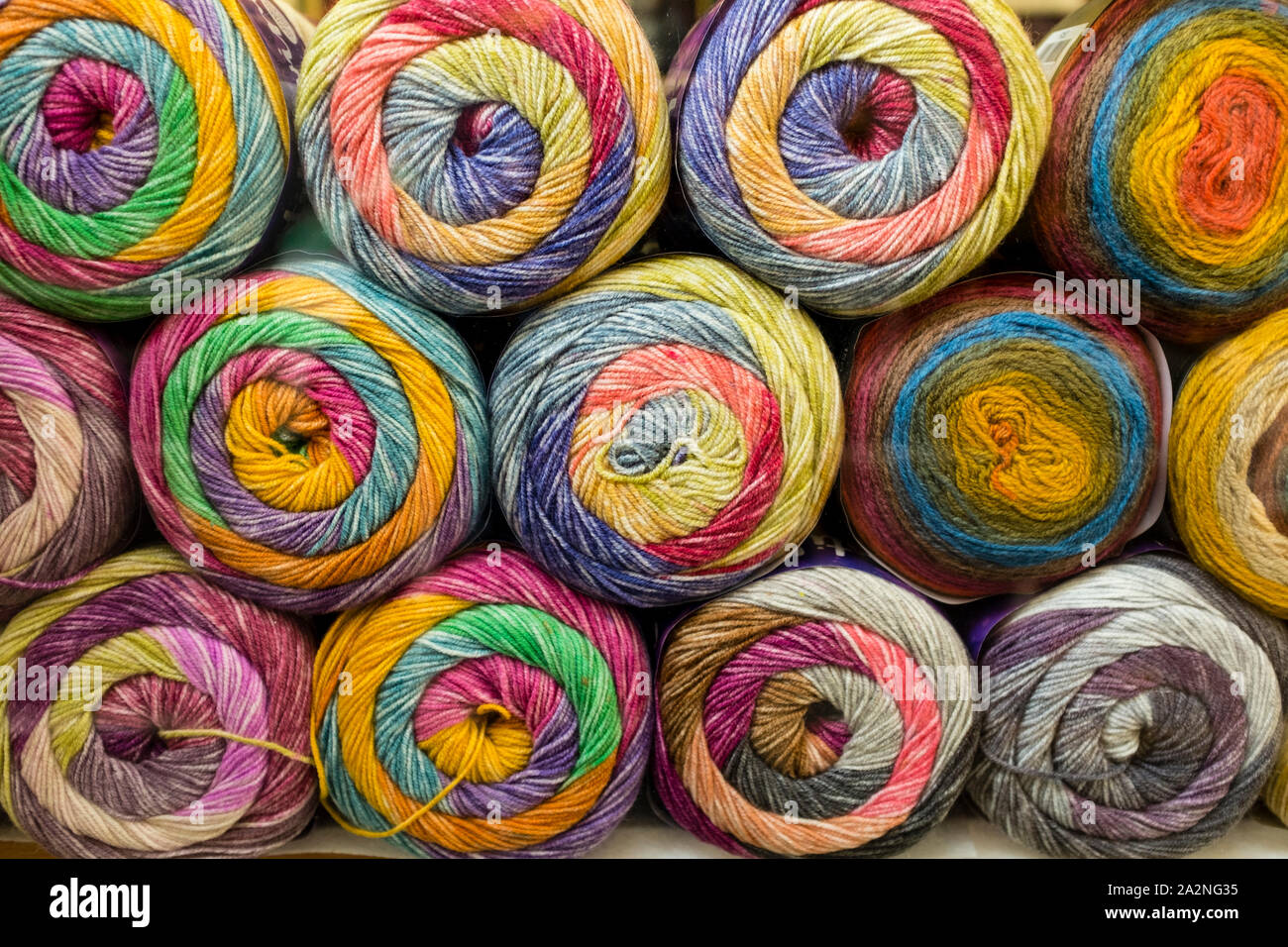 Stacked balls of wool in shop, St Nicholas Market, Bristol, UK Stock Photo