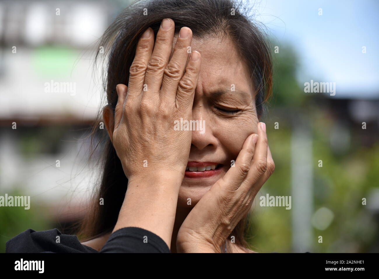 A Filipina Granny And Depression Stock Photo