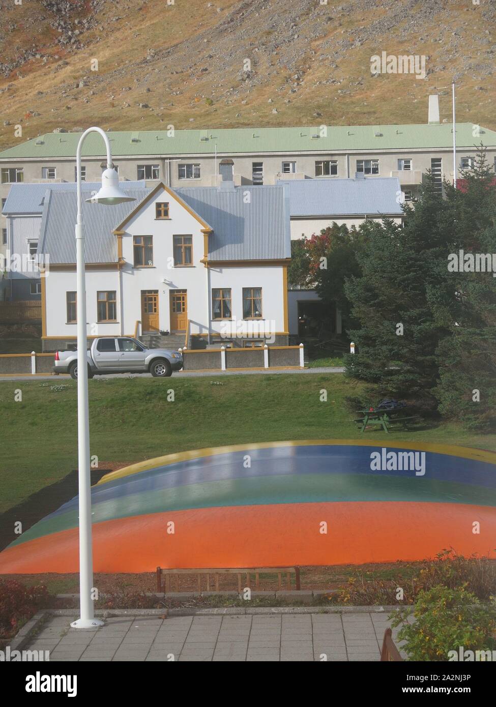An openair rainbowcoloured bouncy trampoline is an attractive