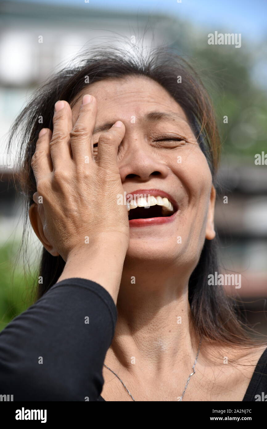 An Asian Grandma Laughing Stock Photo