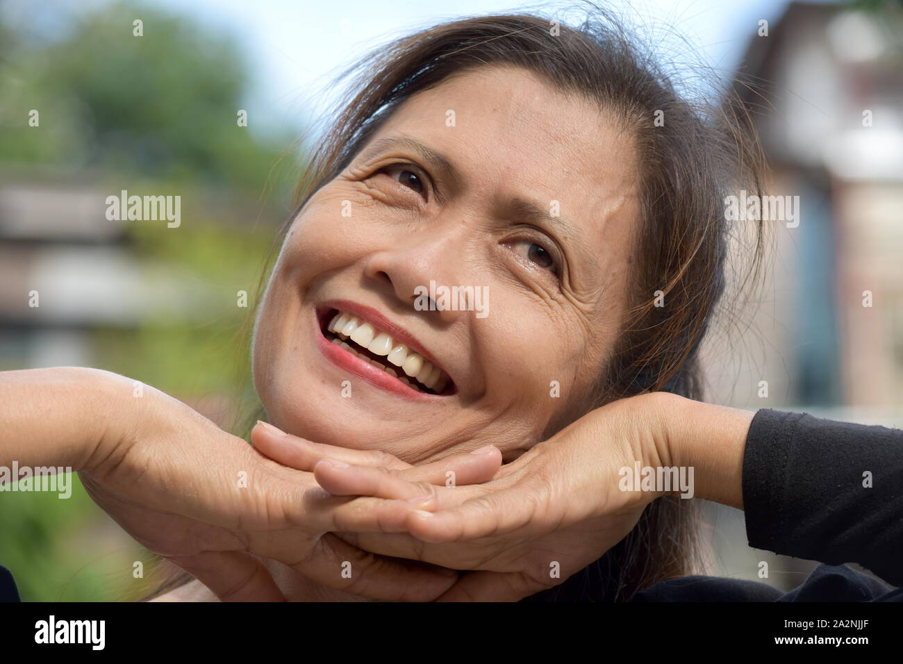 A Happy Asian Female Senior Grandma Stock Photo