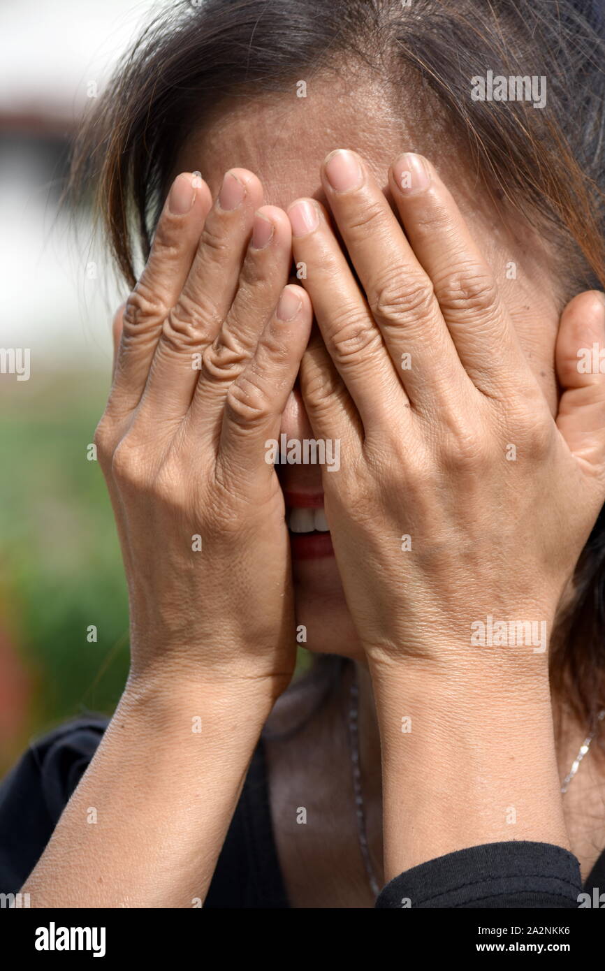 A Depressed Filipina Person Stock Photo