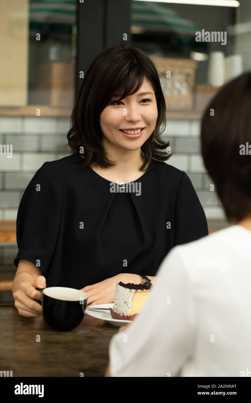 Japanese women at a cafe Stock Photo - Alamy