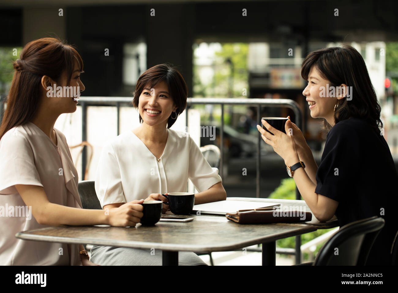 Japanese women at a cafe Stock Photo - Alamy