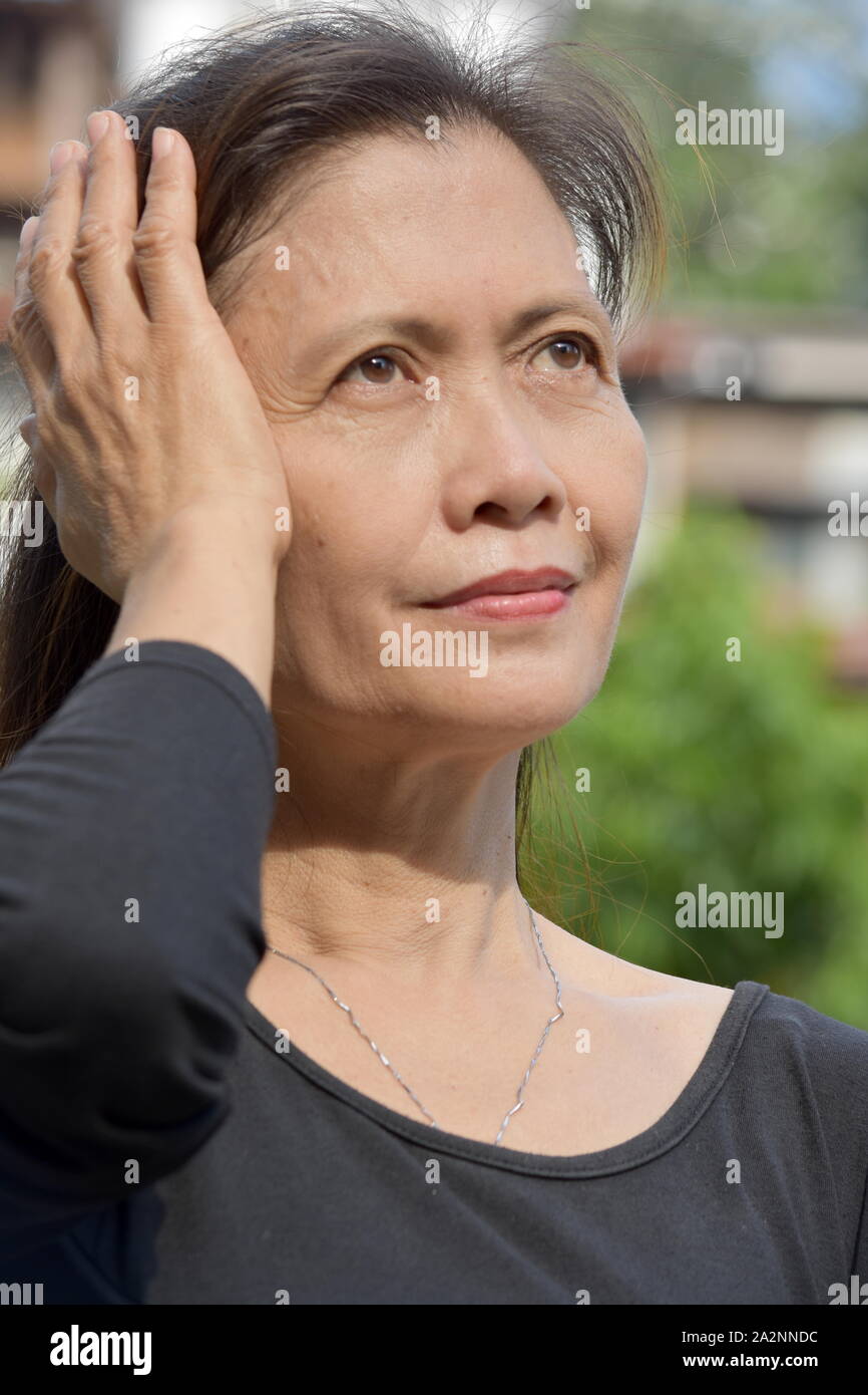 A Minority Female Senior With Alzheimers Stock Photo