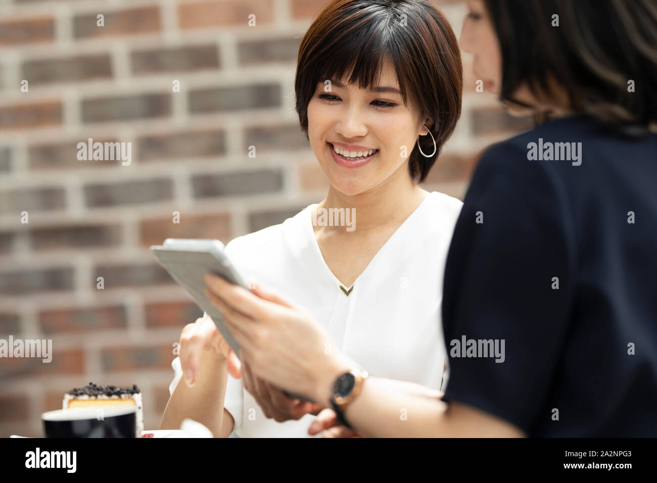 Japanese women at a cafe Stock Photo - Alamy