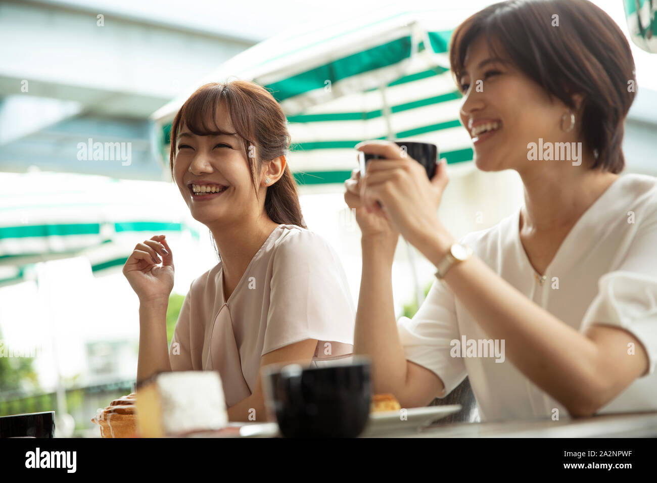 Japanese women at a cafe Stock Photo - Alamy