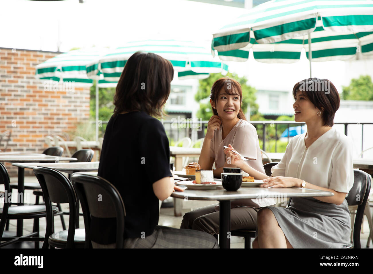 Japanese women at a cafe Stock Photo - Alamy