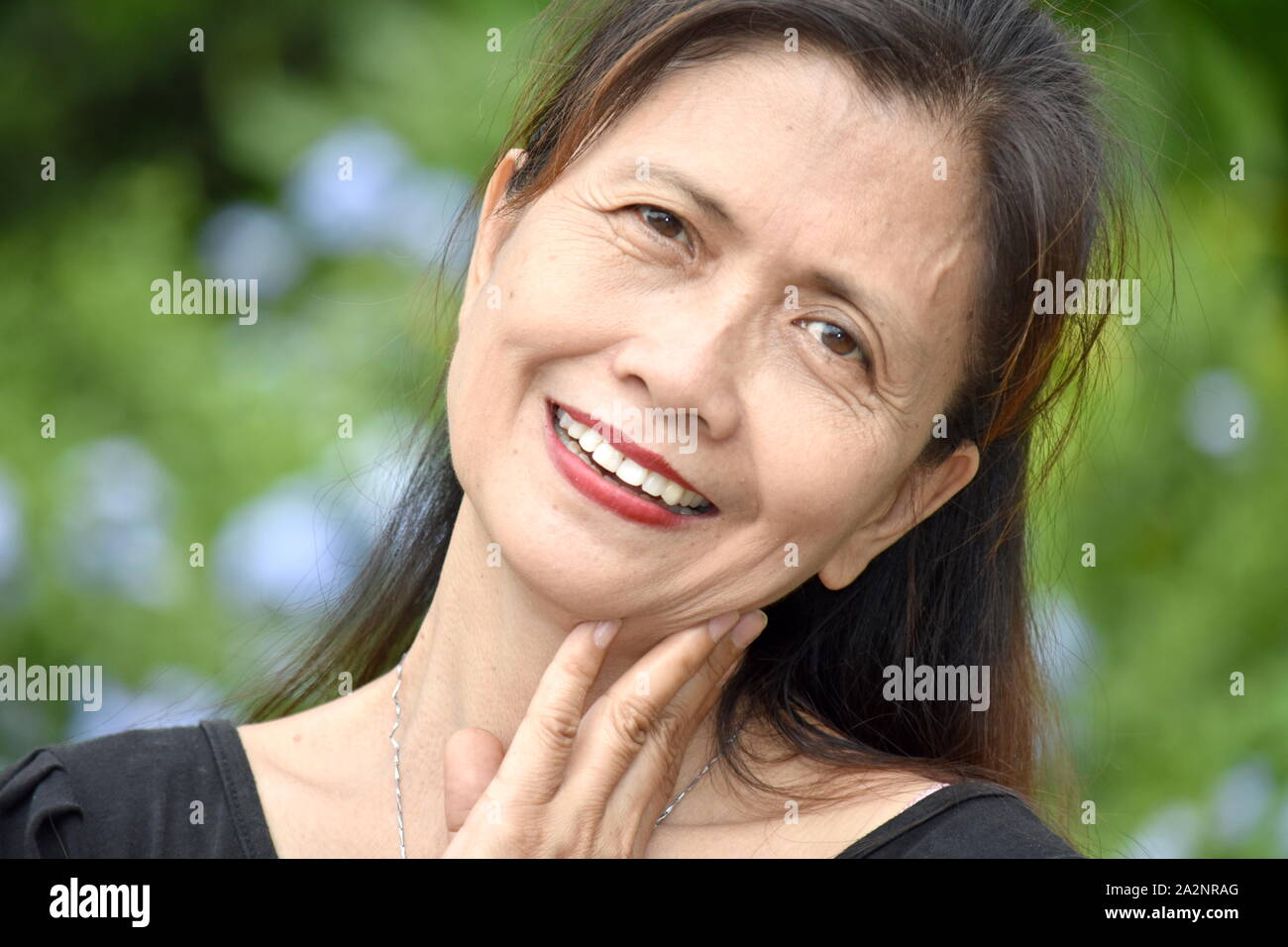 A Smiling Retired Female Senior Stock Photo
