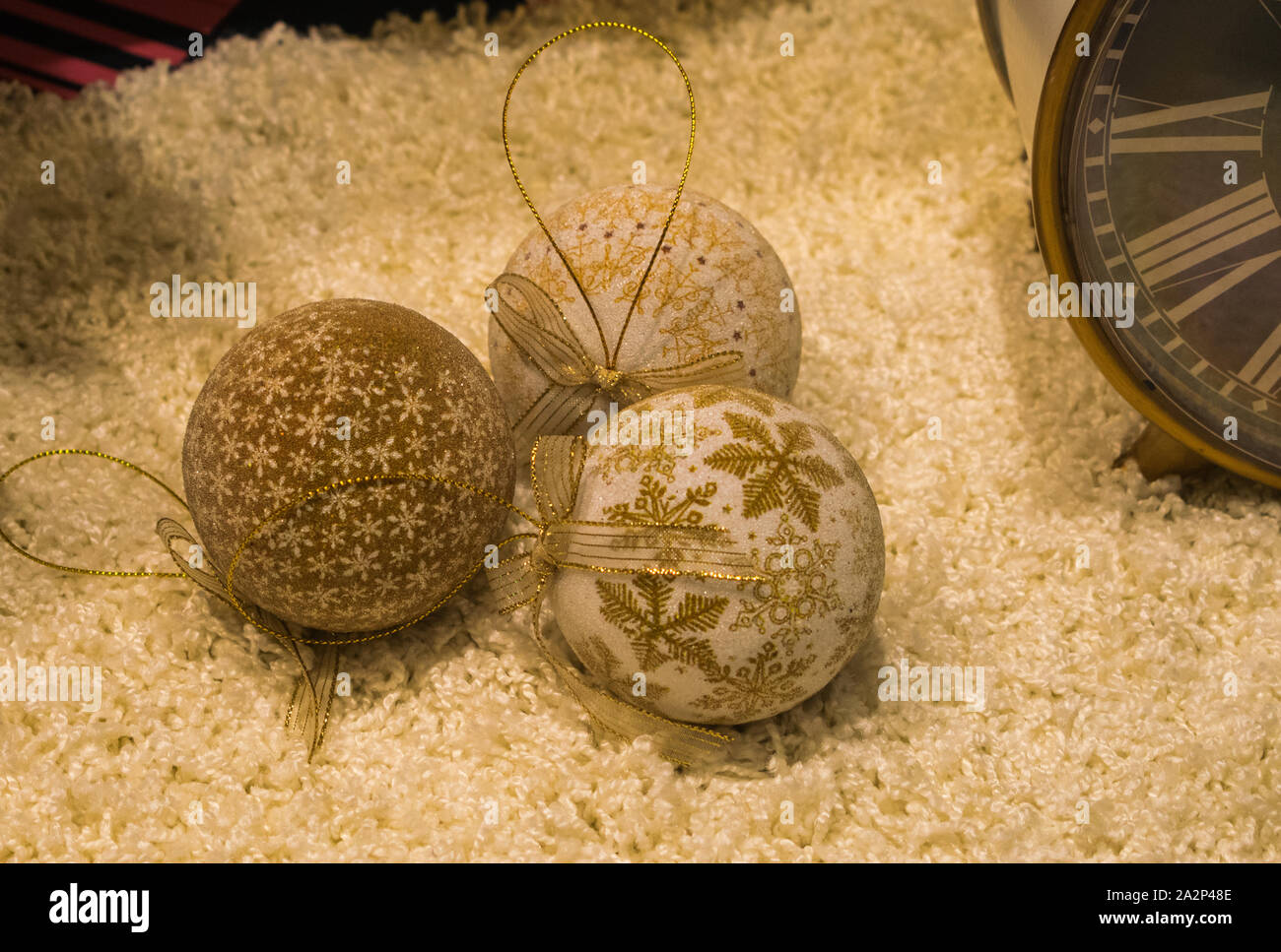 Christmas tree balls on a white carpet Stock Photo