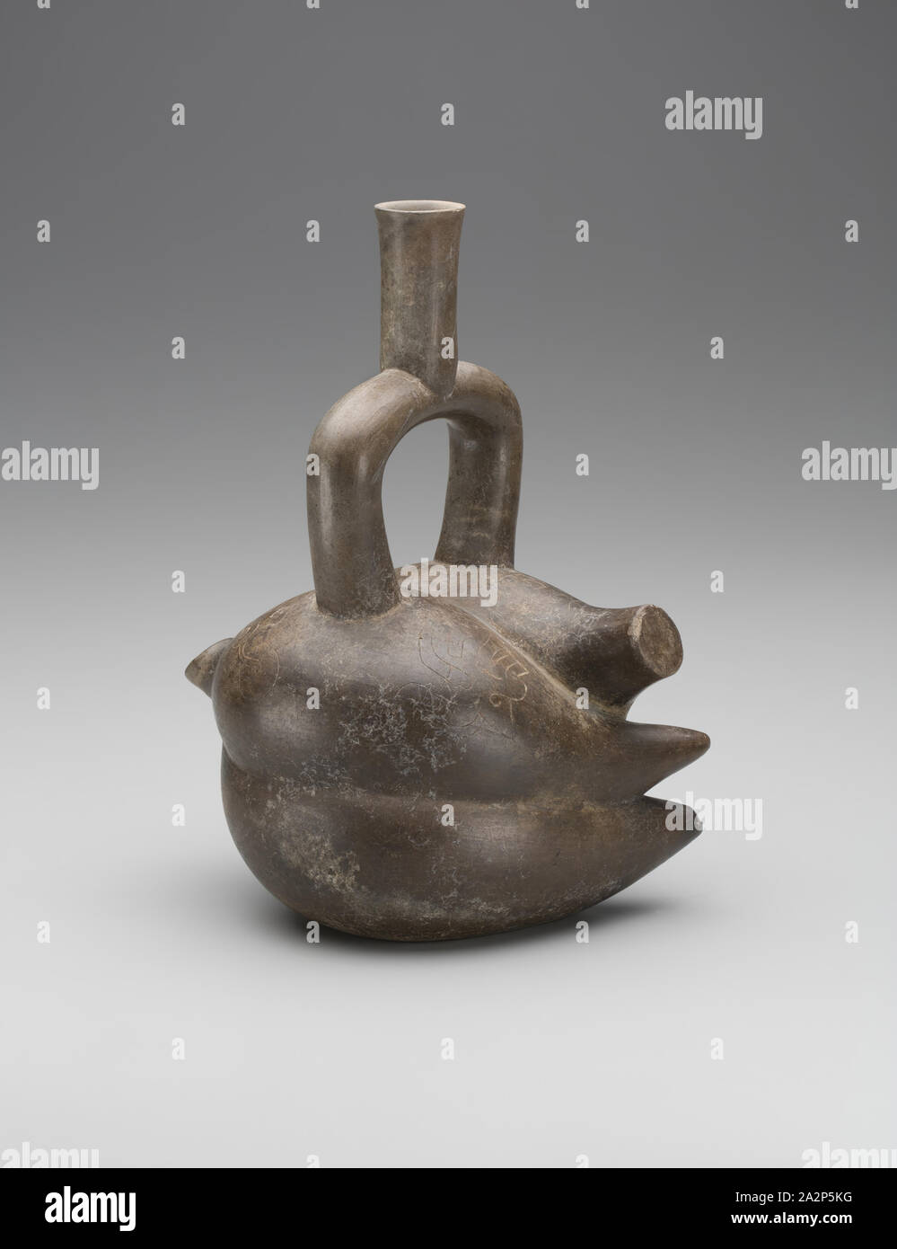 Chavin, Precolumbian, Vessel with Stirrup Spout in the Form of Yucca Root, between 7th and 5th century BCE, Terracotta, Overall: 11 3/8 × 8 5/8 × 6 1/4 inches (28.9 × 21.9 × 15.9 cm Stock Photo