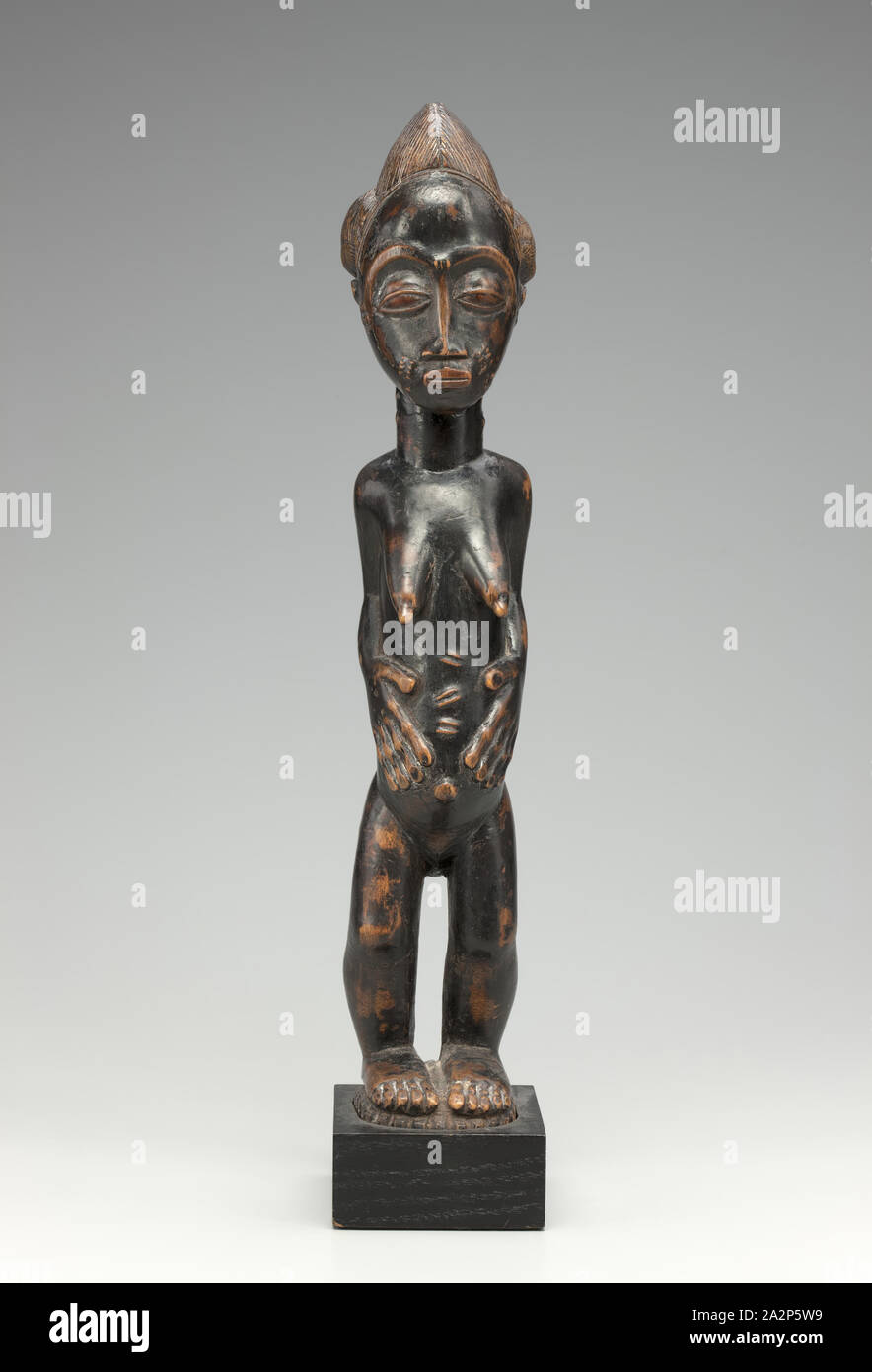 Baule, African, Female Figure, late 19th/early 20th Century, Wood, Dimensions include mount Stock Photo