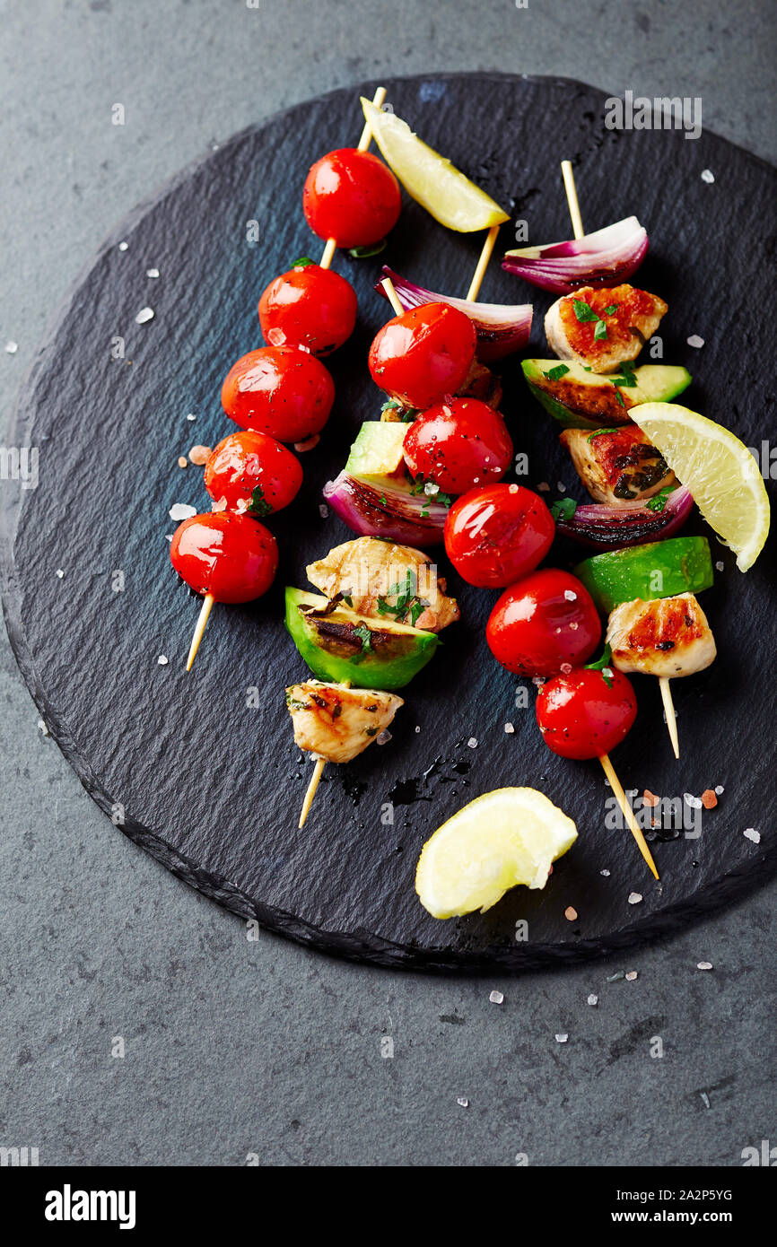 Grilled Chicken, Avocado, Zucchini and Red Onion Skewers Stock Photo