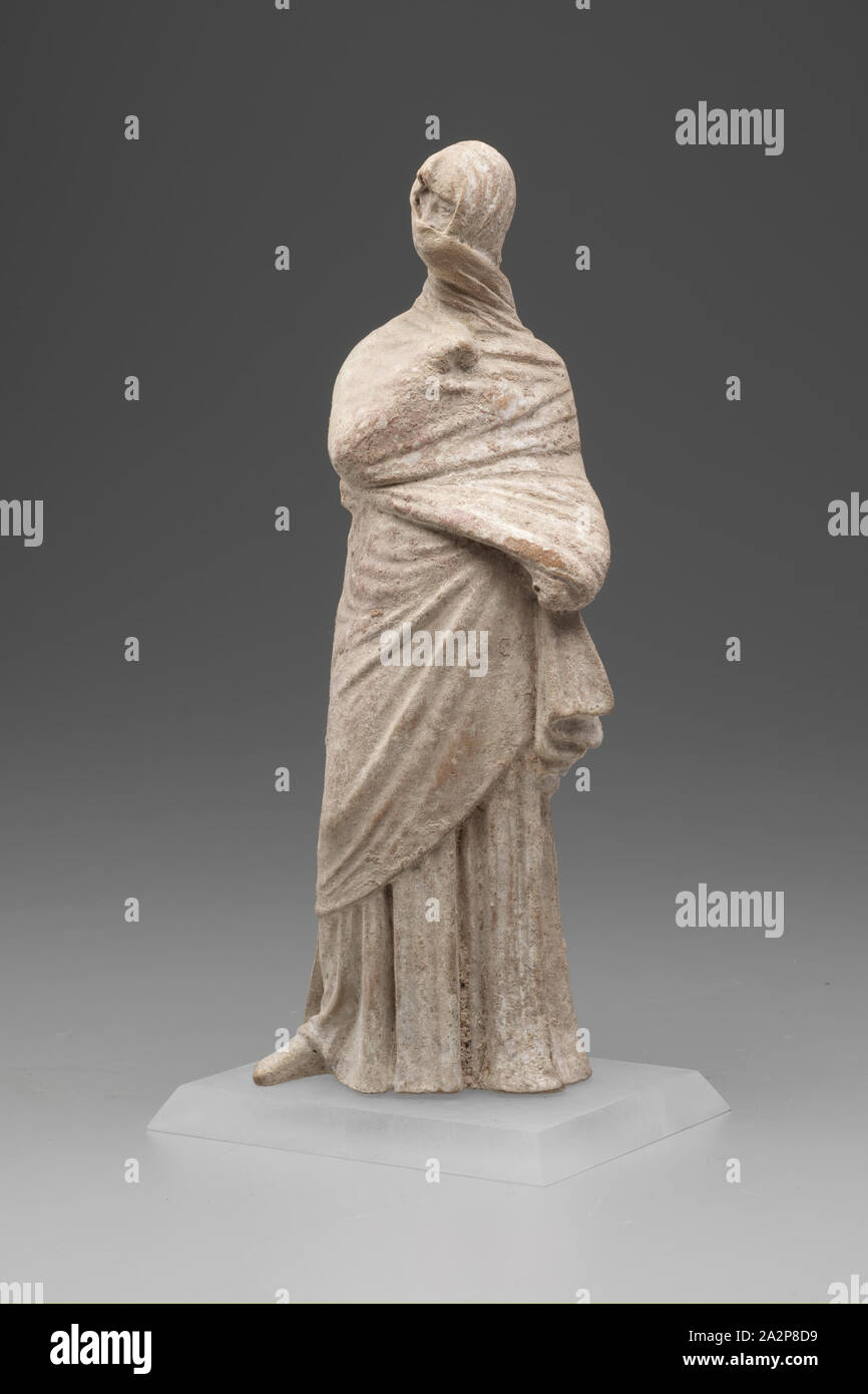 Greek, Female Figure, 3rd or 2nd Century BCE, Terracotta, Overall: 9 3/4 × 3 1/4 × 2 1/4 inches (24.8 × 8.3 × 5.7 cm Stock Photo