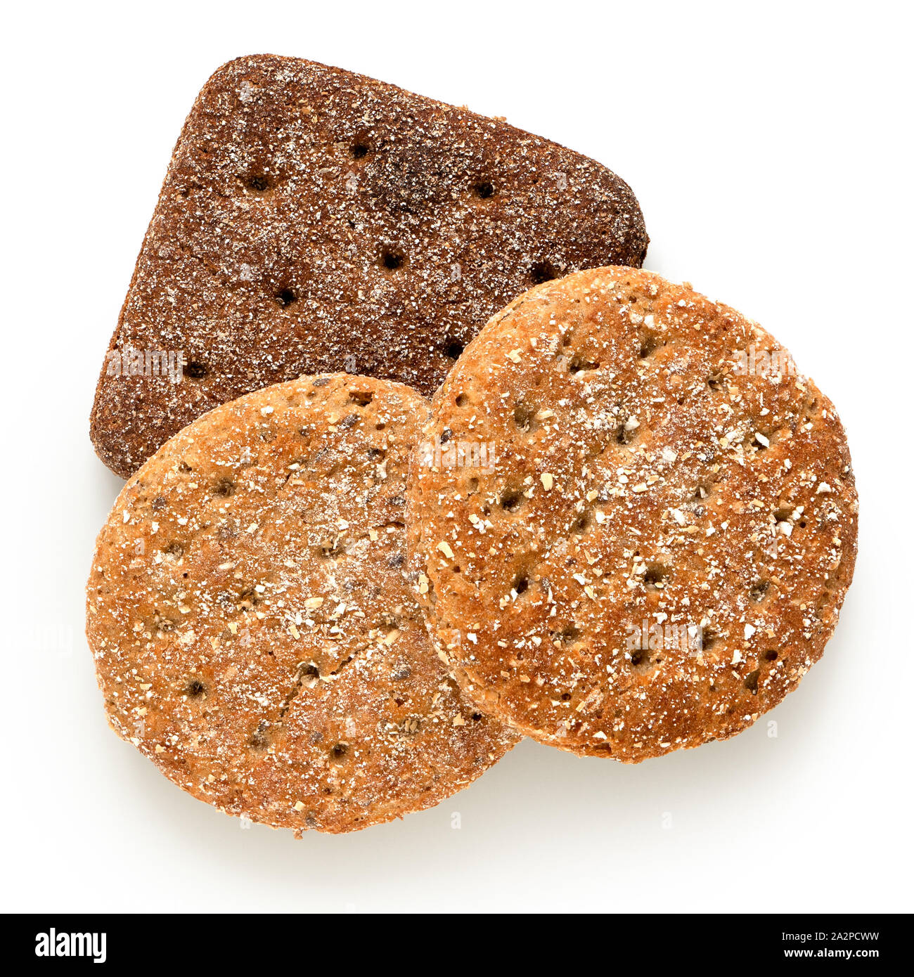 Two round oat wheat flat breads and one square rye flat bread isolated on white. Top view. Stock Photo