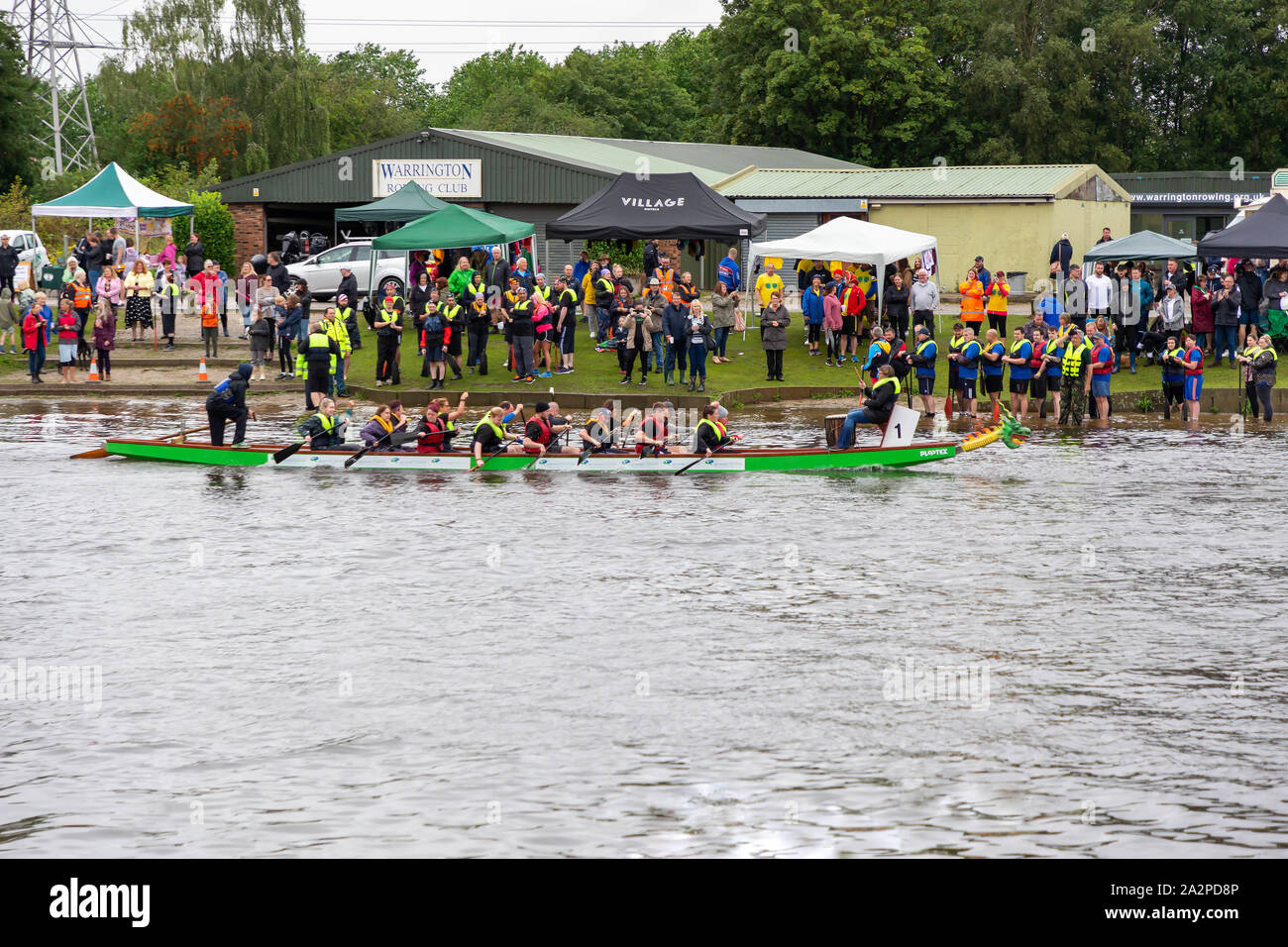 Dragon Boat Race 2019 goes past Warrington Rowing Club  in aid of St Rocco's Hospice, held at Warrington Rowing Club, Cheshire, England Stock Photo