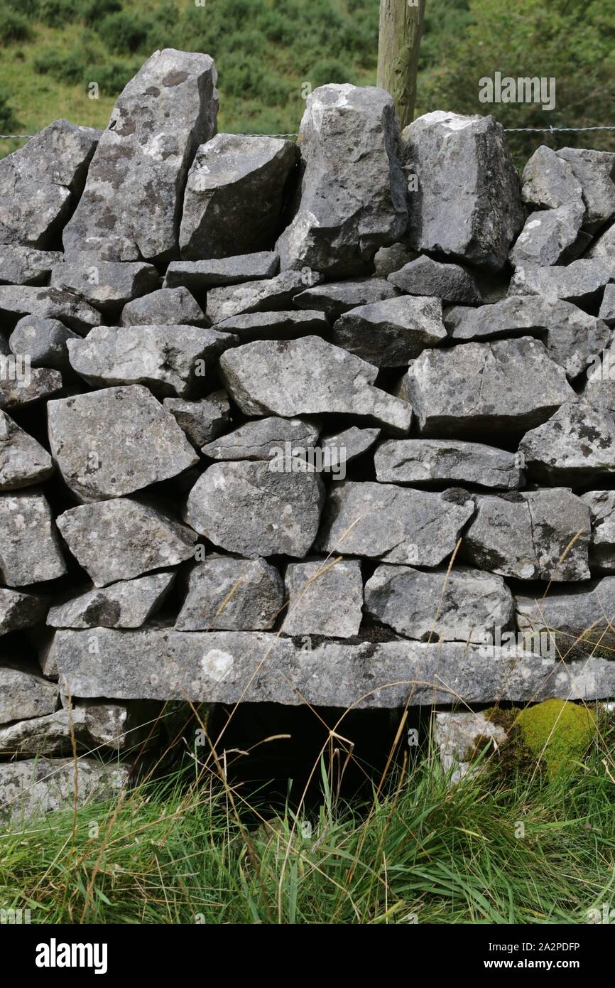 Crip Hole in dry stone wall in Biggin Dale, Derbyshire Stock Photo