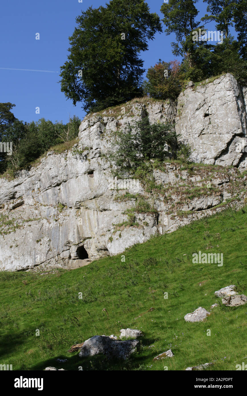 Frank i' th' Rocks cave beside the River Dove in Wolfscote Dale, Derbyshire Stock Photo