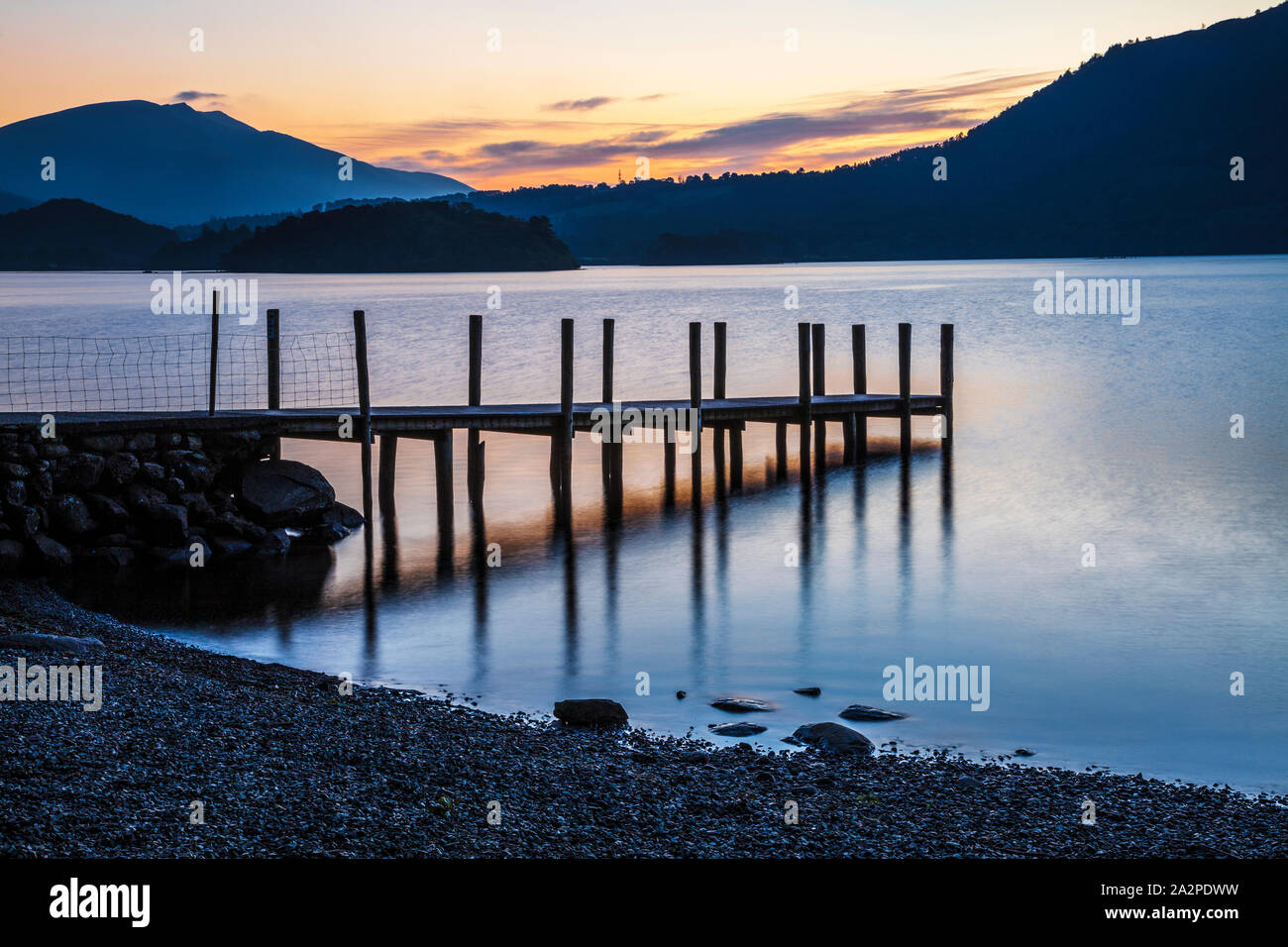 Sunrise over Derwent Water from Brandelhow, Lake District, Cumbria, England, UK Stock Photo