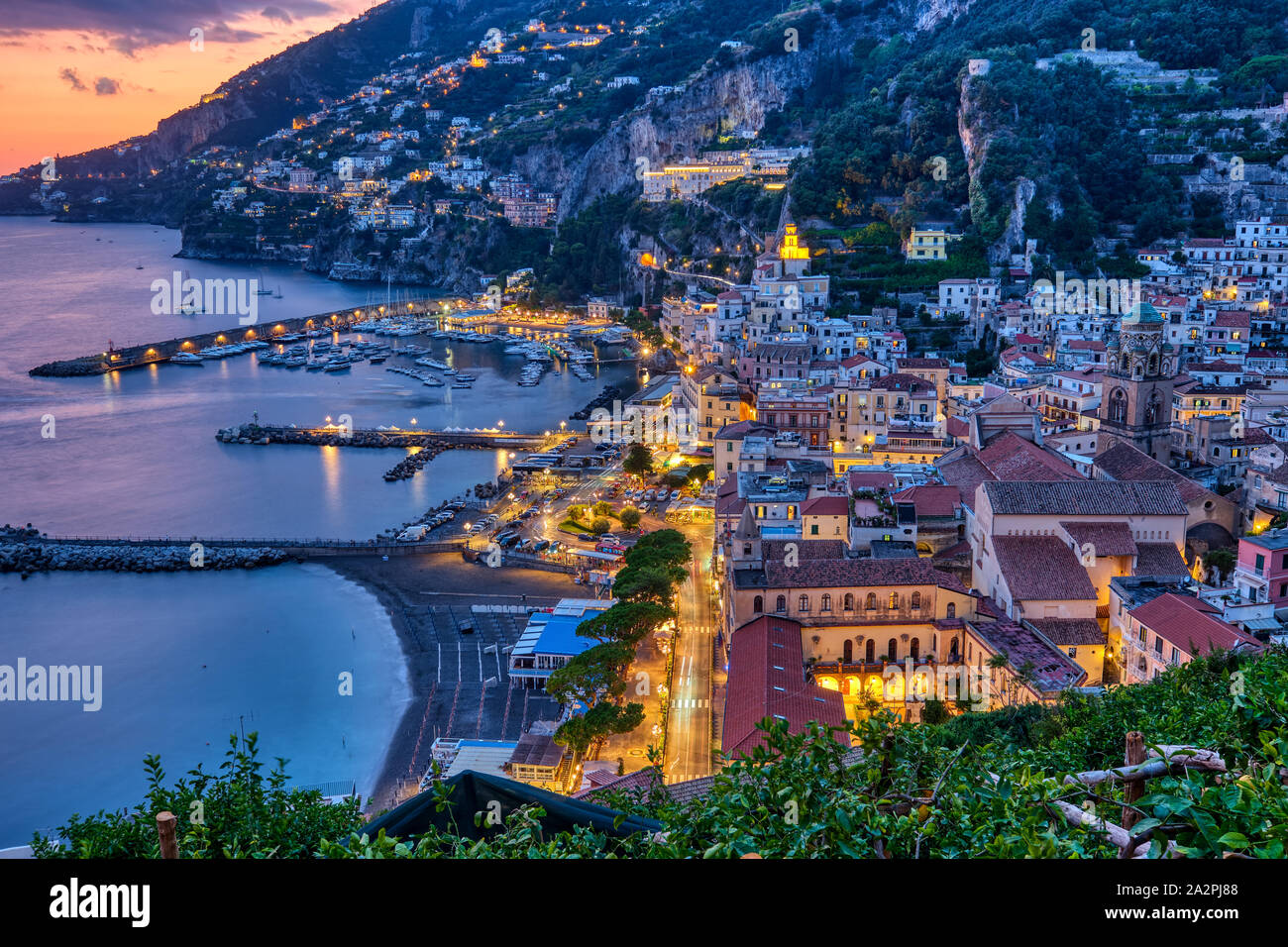 View of Amalfi after sunset on the coast of the same name in Italy Stock Photo