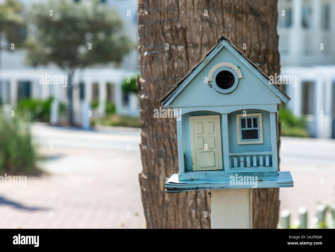 A bird house designed to look like a small home, Florida Stock Photo