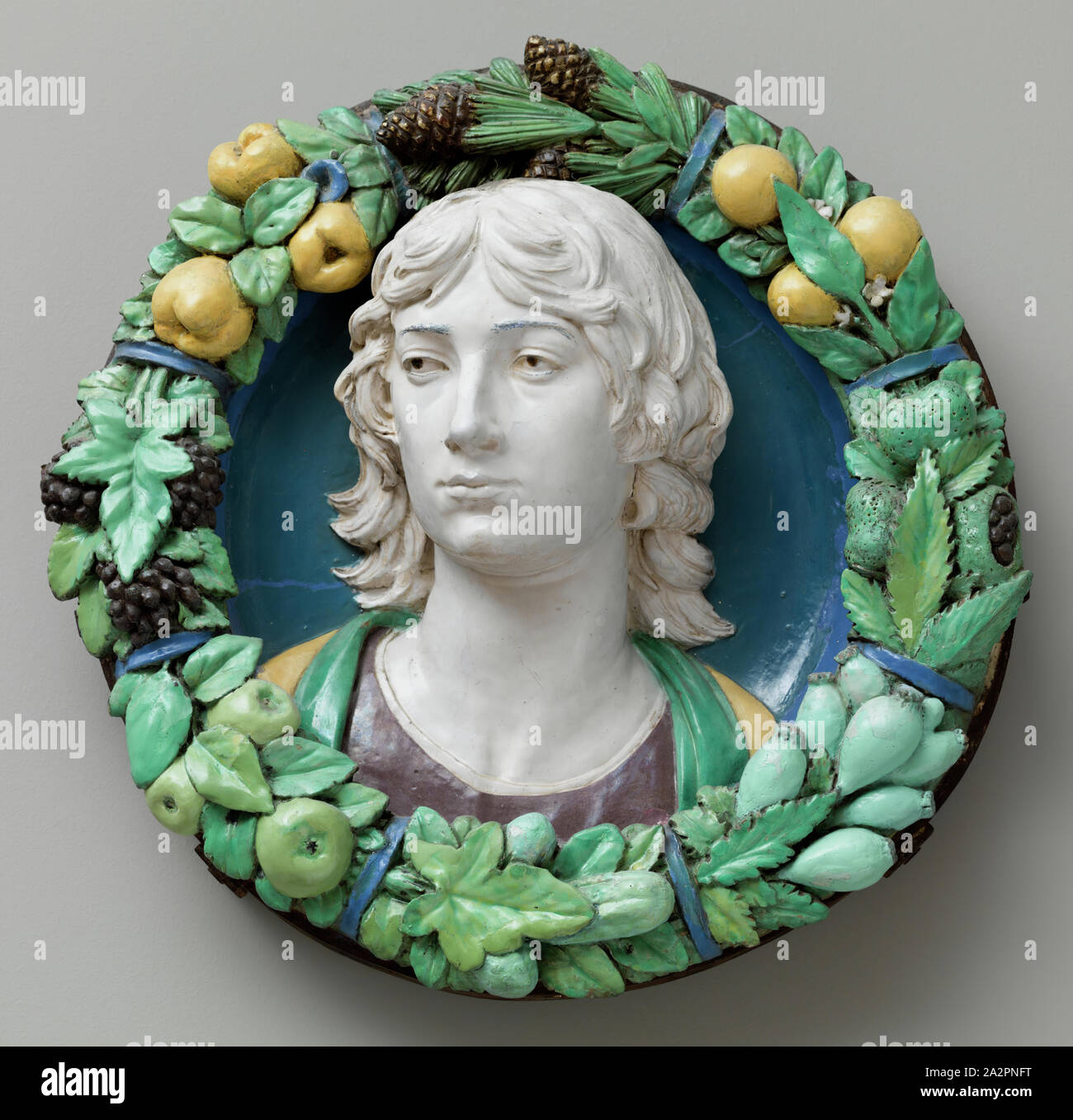 workshop of Andrea della Robbia, Italian, 1435-1525, Head of a Youth, between mid-15th and early 16th century, Enameled terracotta, Overall: 6 1/2 × 22 inches (16.5 × 55.9 cm Stock Photo