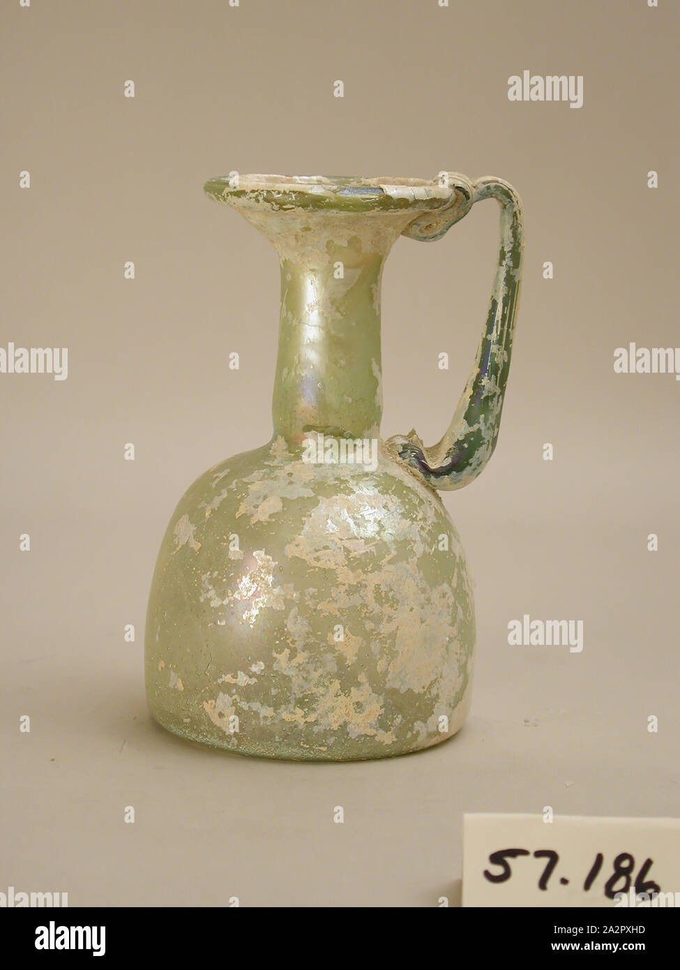 Roman, Pitcher, late 3rd/4th Century AD, Glass, H. 5 5/8 (14.3 cm) Diam. 3 1/2 (8.9 cm Stock Photo