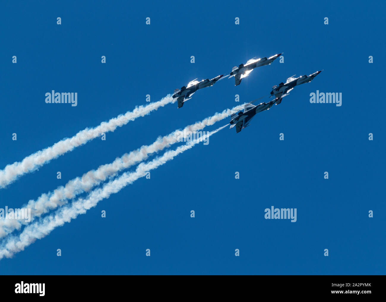 Wantagh, New York, USA - 24 May 2019: The United States Air Force Thunderbird's flying upside down during a performance at an air show. Stock Photo