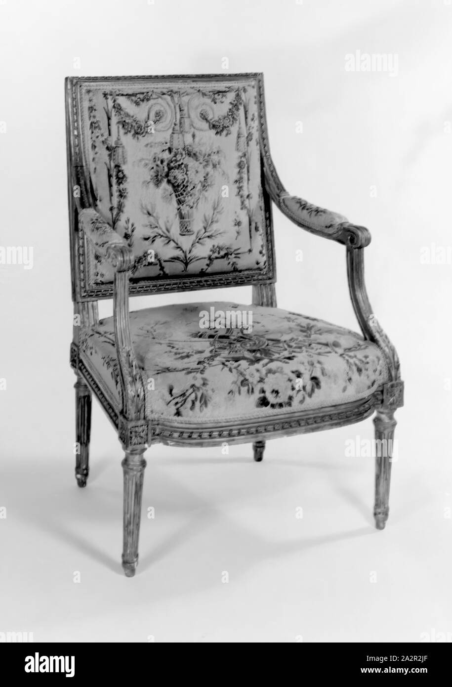 Georges Jacob, French, 1739-1814, Arm Chair, c. 1780/1785, carved and gilded beechwood frame, wool and silk upholstery (Beauvais tapestry), 35 3/4 x 25 1/8 x 22 in. (90.8 x 63.8 x 55.88 cm Stock Photo