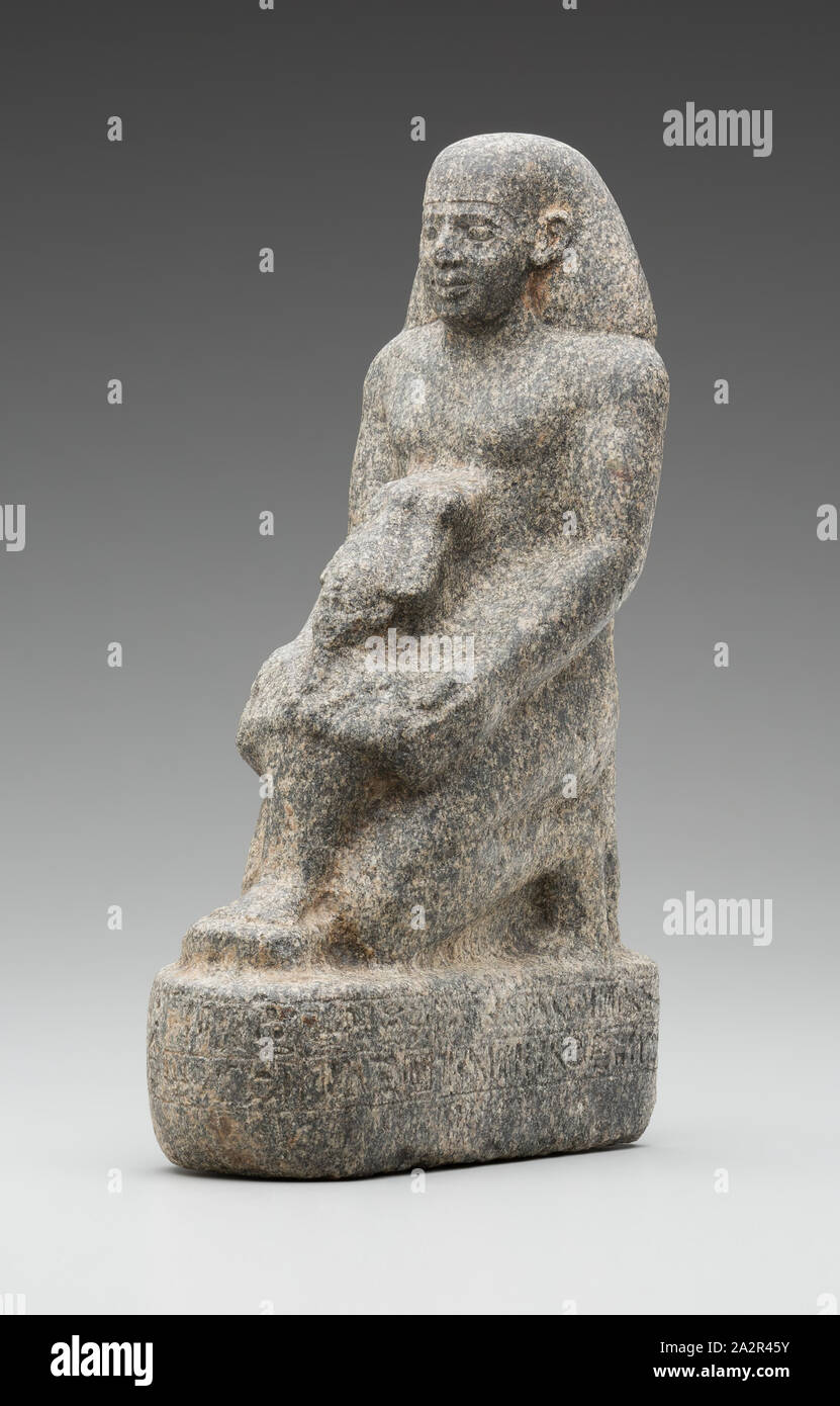 Egyptian, Kneeling Man Holding a Statue of the God Osiris, 626/525 BC, Granite, 11 7/8 x 4 1/4 x 6 7/8 in Stock Photo