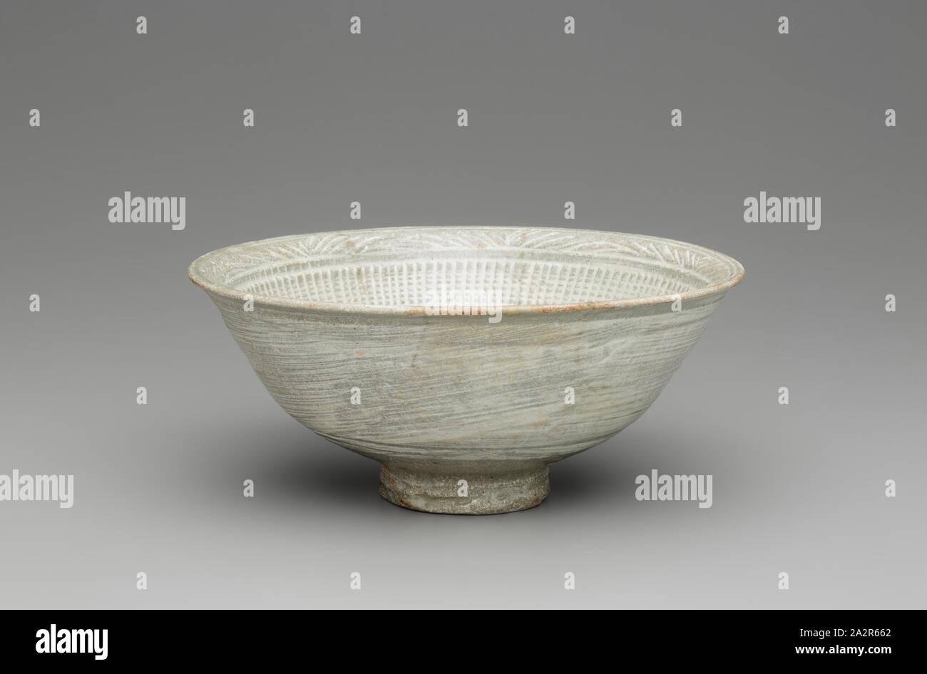 Unknown (Korean), Deep Bowl with Chrysanthemum Decoration, 15th/16th Century, Stoneware with white slip decoration and light green glaze, Overall: 3 1/4 × 7 3/8 inches (8.3 × 18.7 cm Stock Photo