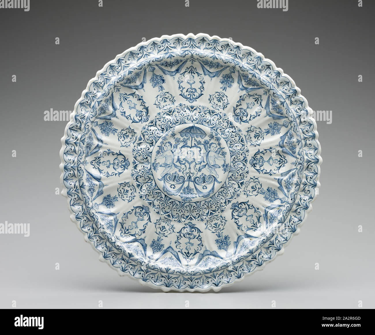 Unknown (Italian), Large Plate, ca. 1700, Tin-glazed earthenware with polychrome decoration, Overall: 1 1/2 × 16 1/8 inches (3.8 × 41 cm Stock Photo