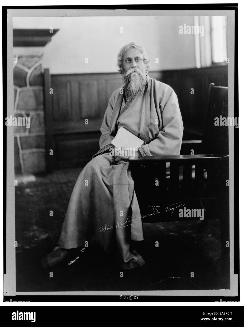 Rabindranath Tagore, full-length portrait, seated, facing front Stock Photo