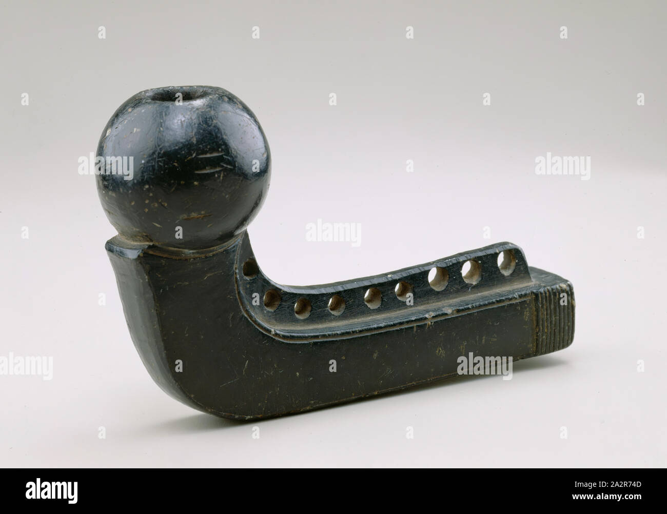 Chippewa, Native American, Pipe Bowl, ca. 1850, black/brown stone (olivine series, possibly fayalite), Overall: 3 3/8 × 5 1/4 × 1 3/4 inches (8.6 × 13.3 × 4.4 cm Stock Photo