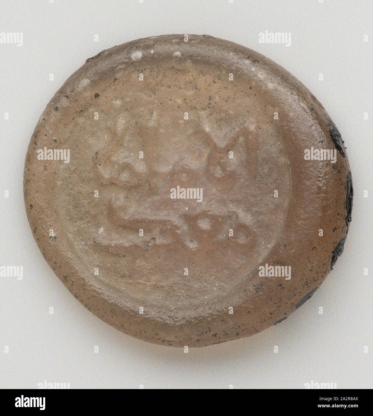 Islamic, Egyptian, Quarter Dirham Coin Weight from the Reign of the Fatimid Caliph al-Mustansir, 1036/1094, Glass, 1/8 x 9/16 in. diam. ( .32 x 1.42 cm Stock Photo