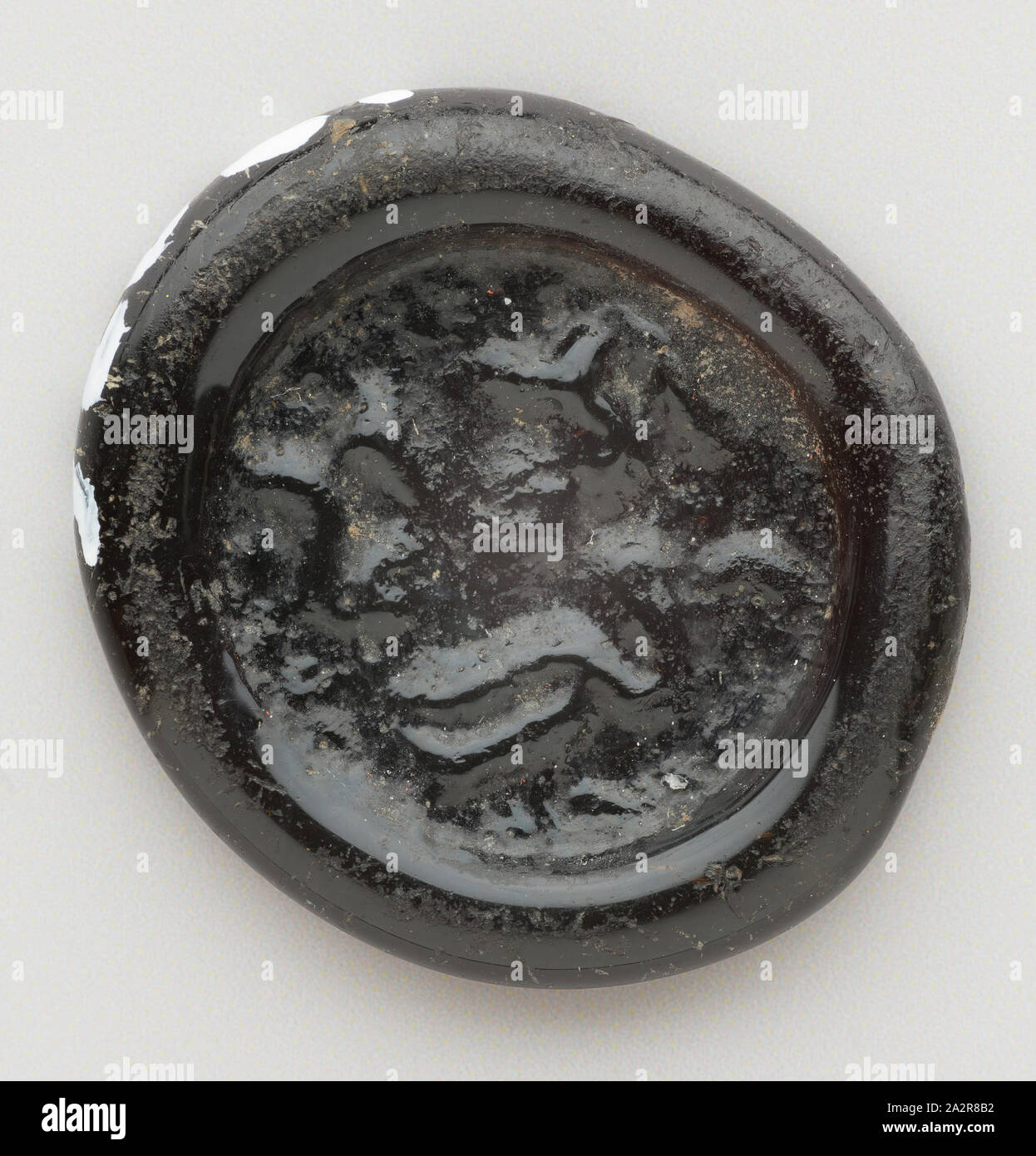 Islamic, Egyptian, Quarter Dirham Coin Weight from the Reign of the Fatimid Caliph al-Mustansir, 1036/1094, Glass, 1/16 x 9/16 in. diam. ( .15 x 1.42 cm Stock Photo