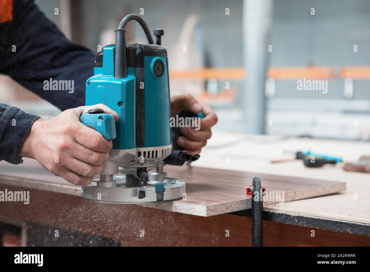 Furniture production or craft concept: worker polishing the wood surface of  furniture part with polish machine Stock Photo - Alamy
