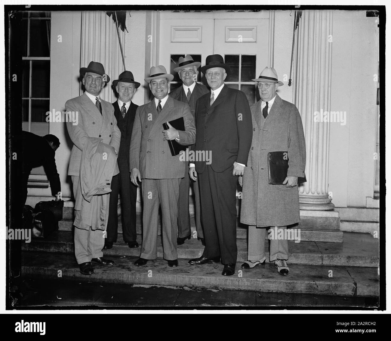 Rail management and Labor executives confer with President Roosevelt. Washington, D.C., Sept. 20. Following a conference today with representatives of Railway Management and Labor at the White House, President Roosevelt announced that he had named an informal six-man committee to devise a broad plan of rail aid legislation for the next congress. The committee comprises three rail management executives and three rail labor chiefs. Attending today's conference were, left to right: Ernest E. Norris, President of the Southern R.R.; D.B. Robertson, representing locomotive firemen and engineers; Geo Stock Photo