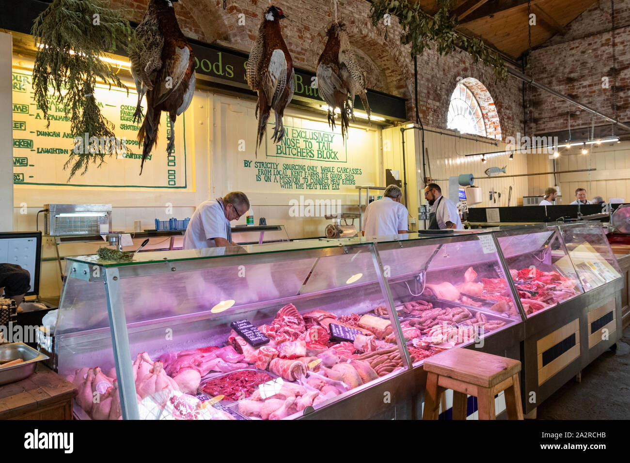 The goods shed, Butchers, pheasants hanging from ceiling, canterbury, kent, uk Stock Photo