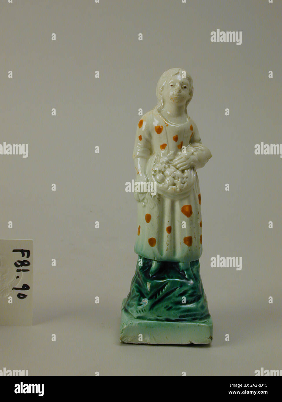manner of Ralph Wood, English, 1715-1772, Figure of a Girl, c. 1770, glazed earthenware, 5 3/4 x 2 in Stock Photo
