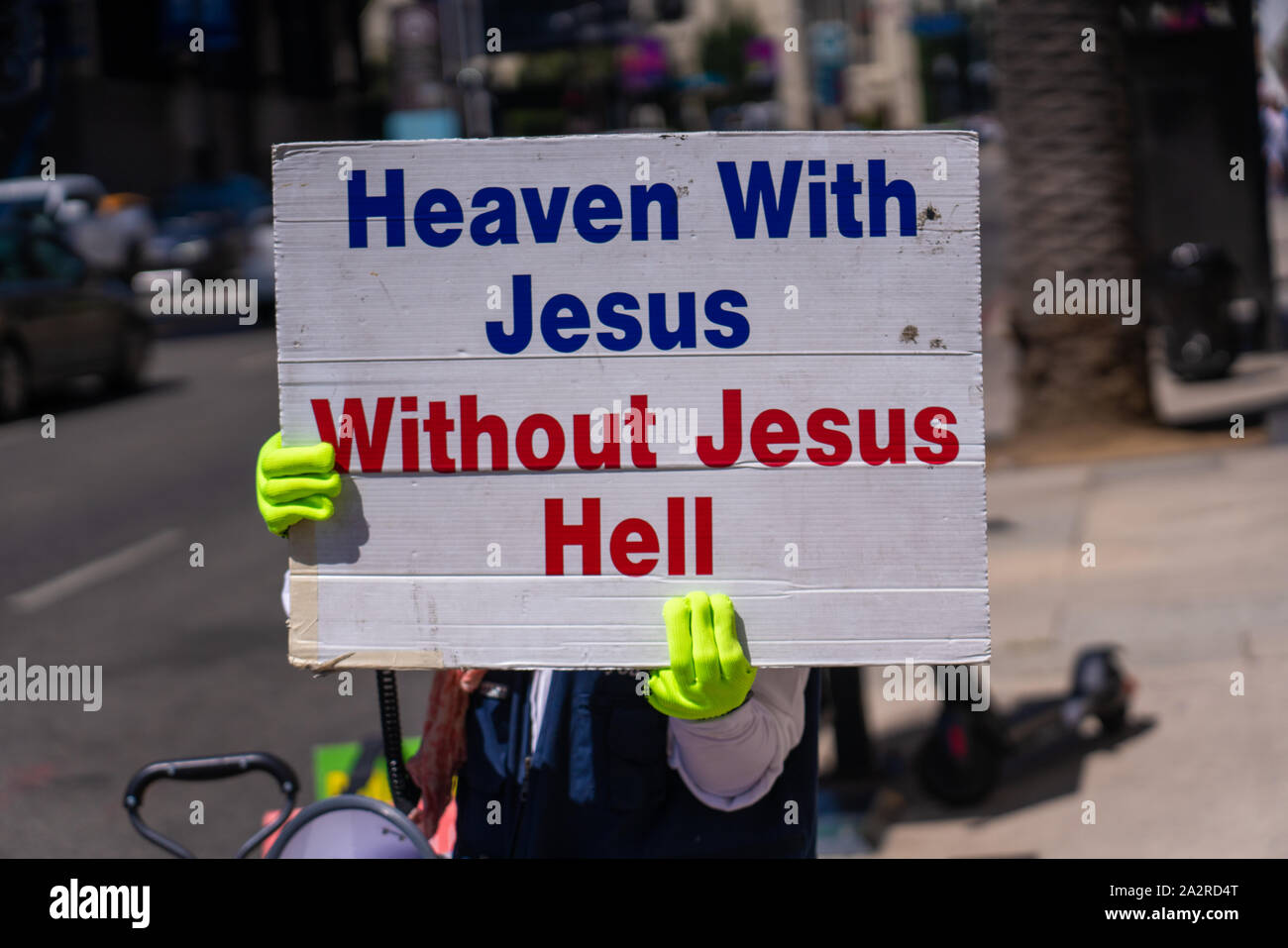 Christian demonstrator at Hollywood Walk of Fame in Los Angeles, with sign reading, 'Heaven With Jesus/Without Jesus Hell.' Stock Photo