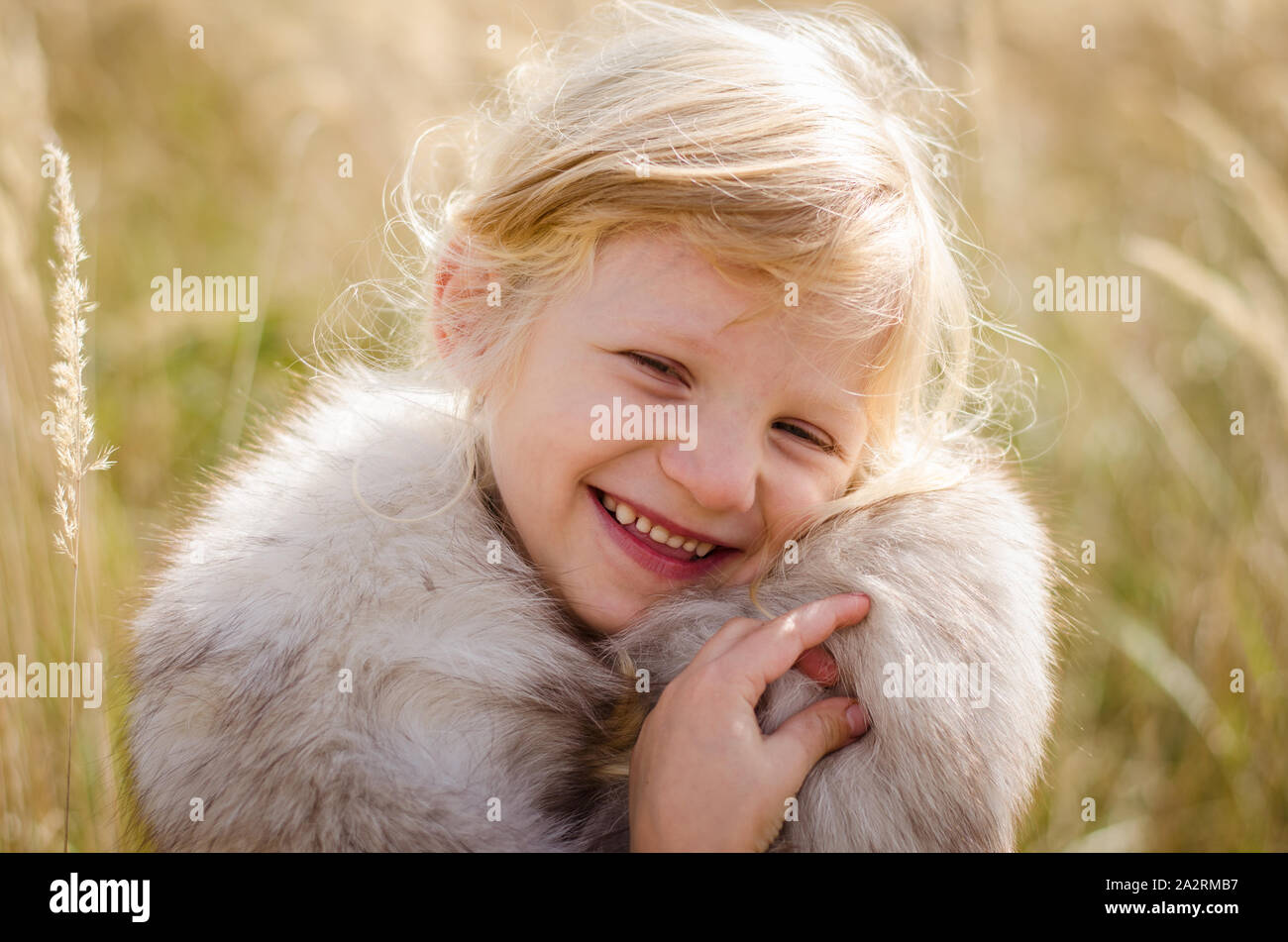 beautiful little happy smiling blond girl portrait Stock Photo - Alamy