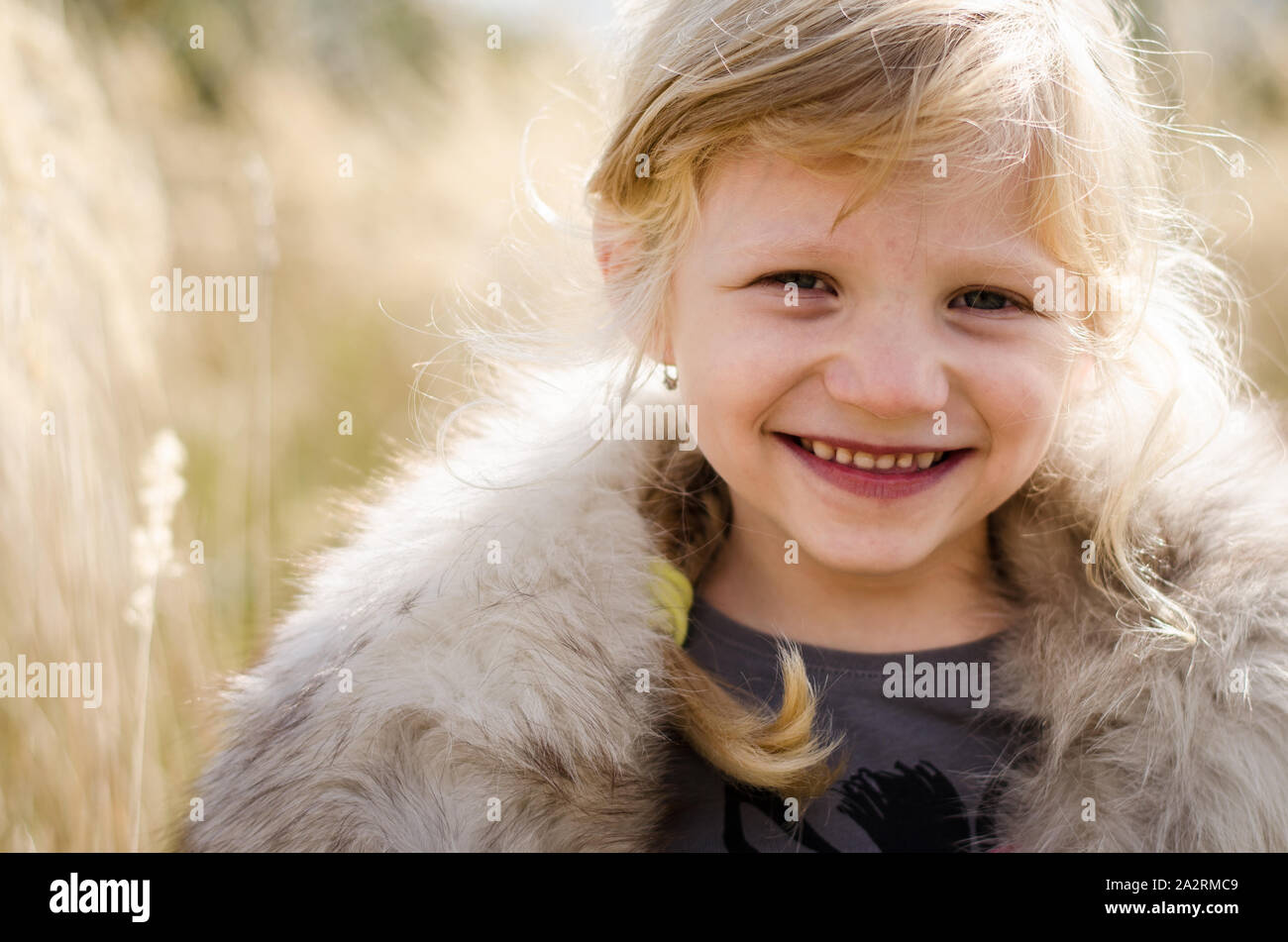 beautiful little happy smiling blond girl portrait Stock Photo - Alamy