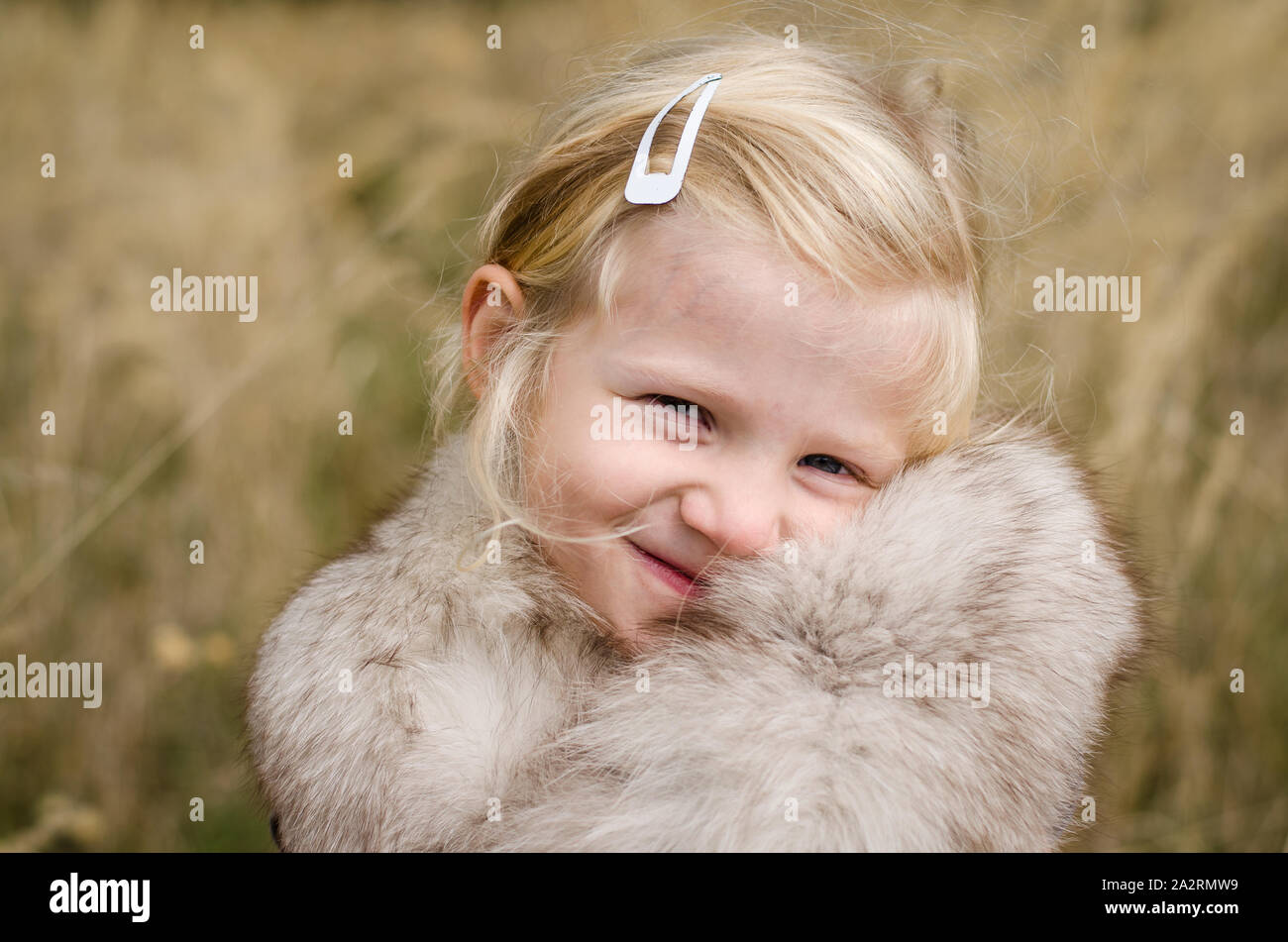 beautiful little happy smiling blond girl portrait Stock Photo - Alamy