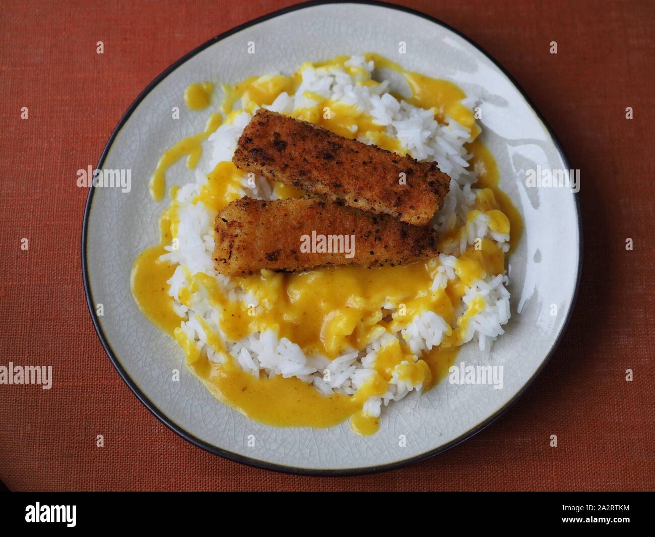 Rice, fish fingers and sauce Stock Photo Alamy