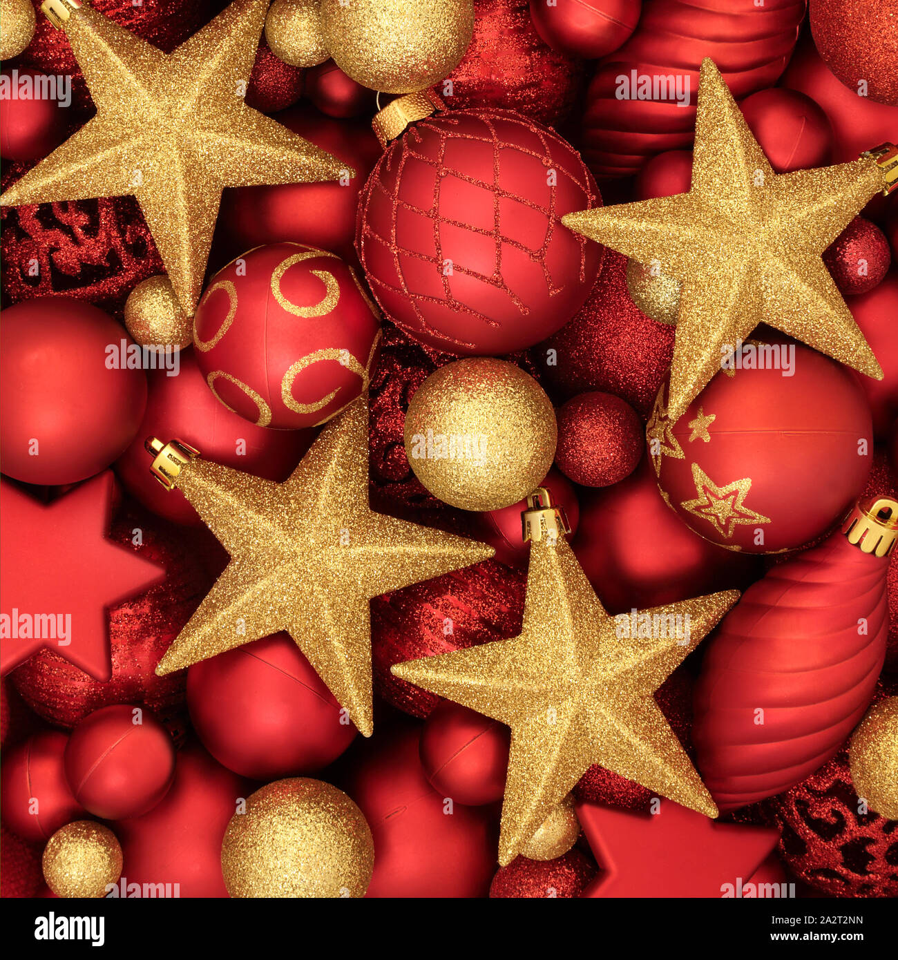 Christmas tree bauble decorations in red and gold forming a background