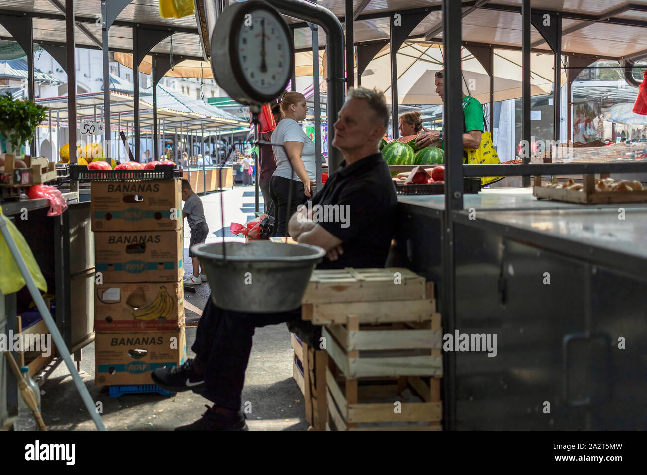 Belgrade, Serbia, Aug 15, 2019: Urban scene with customers and sellers around the stalls at Kalenić Green Market Stock Photo