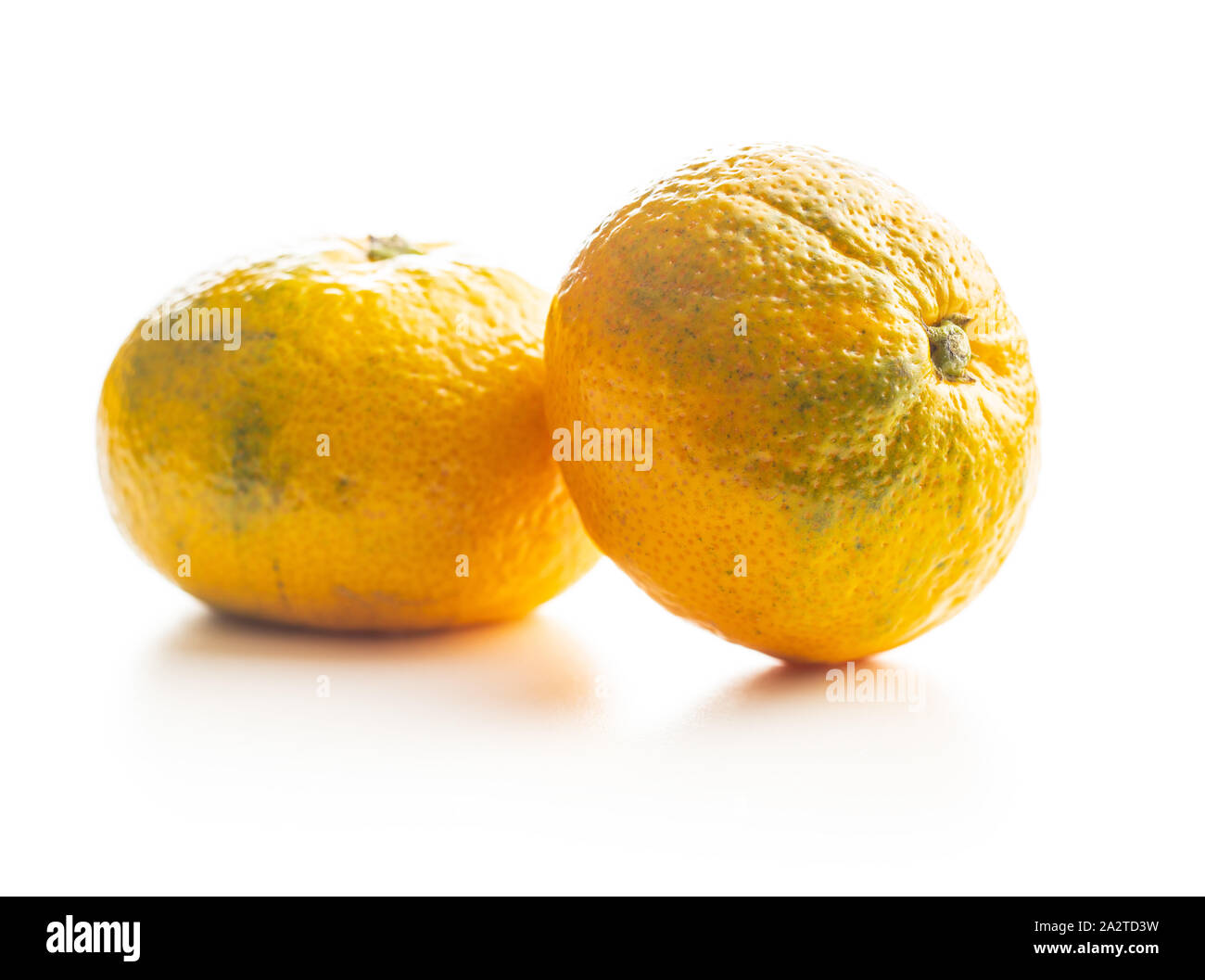 Fresh yellow tangerines isolated on white background. Stock Photo