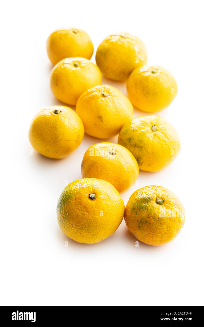 Fresh yellow tangerines isolated on white background. Stock Photo